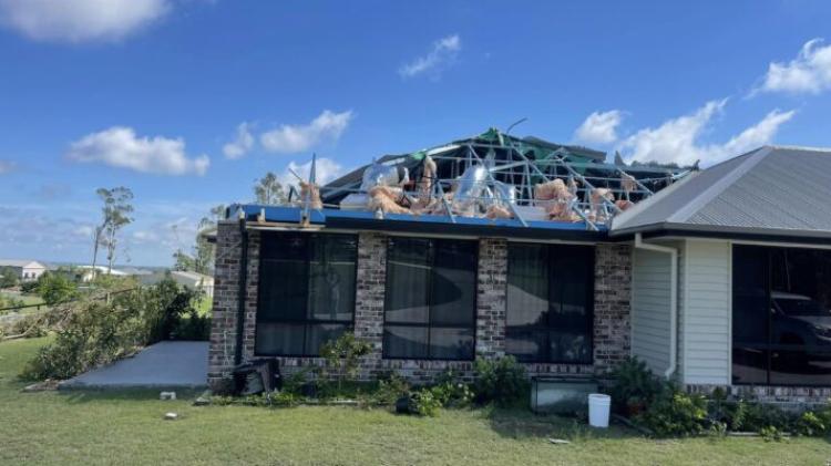 A house with a significantly damaged roof