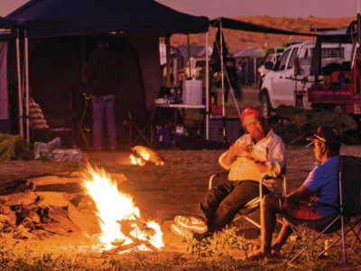 People sitting around a campfire